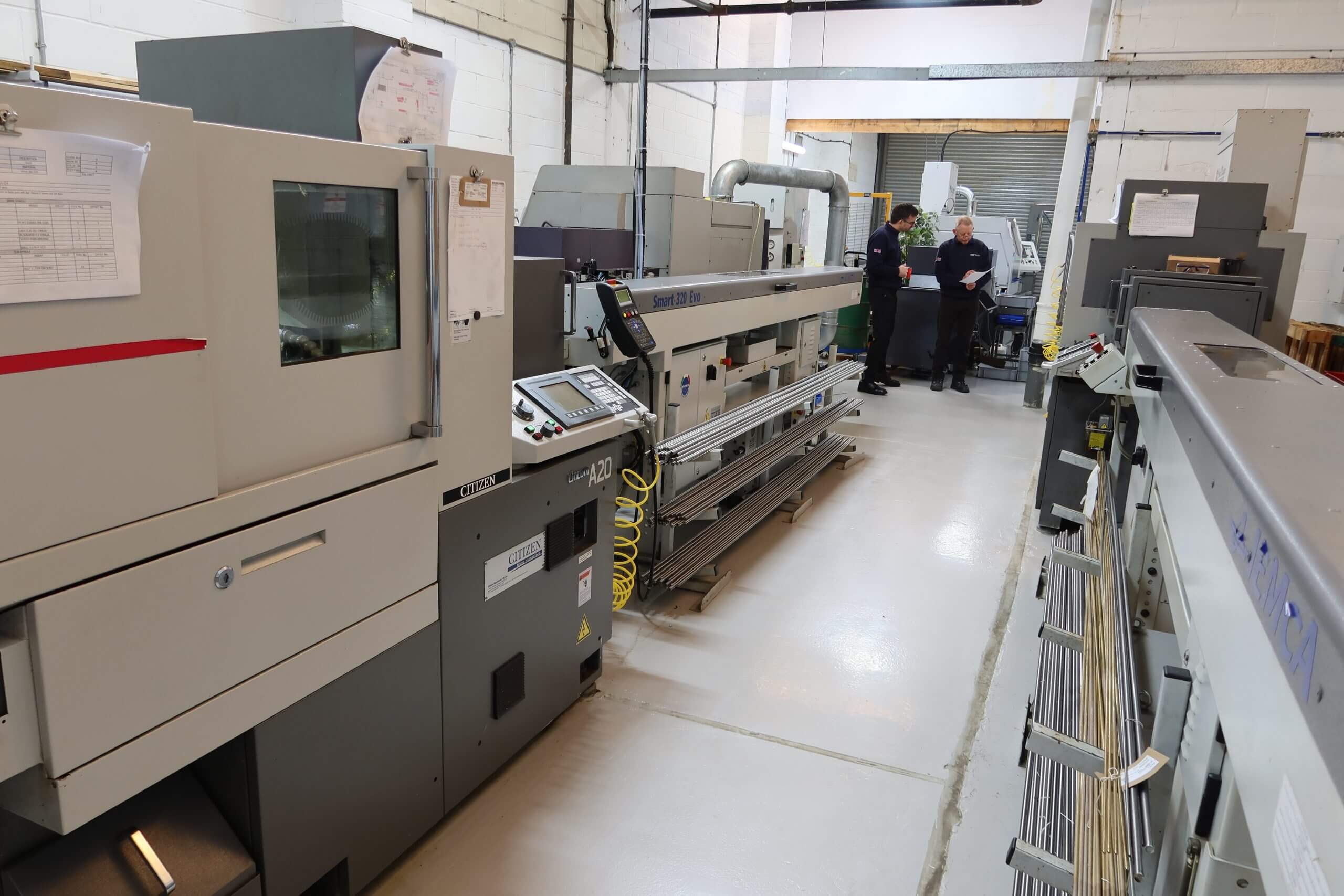 Sliding head CNC machining area with Citizen lathe and bar feeder in operation