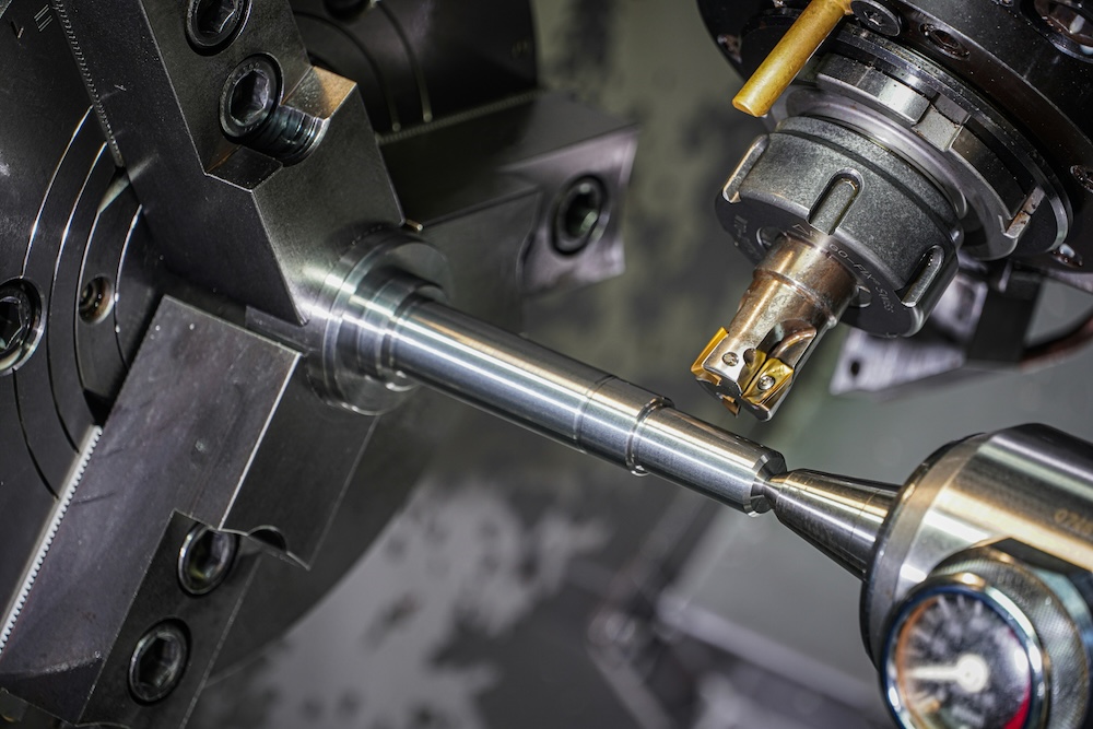 A CNC machine manufacturing a product from metal materials.
