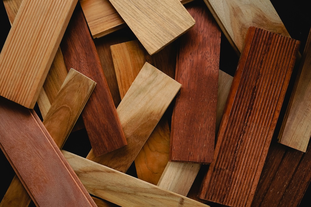 A close up of a pile of wooden planks.